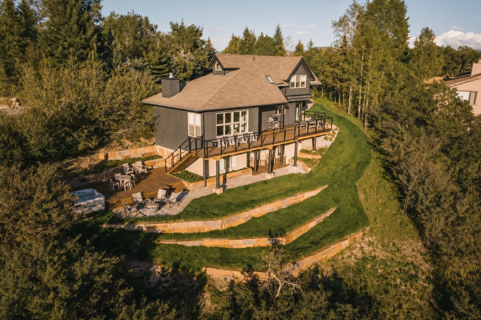 Terraced hillside and stone walls around a mountain home